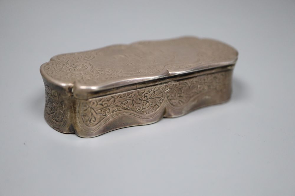 A late Victorian engraved silver shaped oval snuff box, Colen Hewer Cheshire, Birmingham, 1893, 82mm, 89.4 grams.